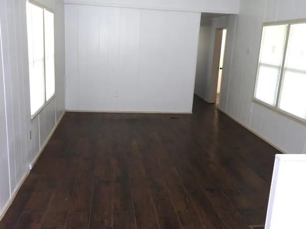 a kitchen with a refrigerator and window