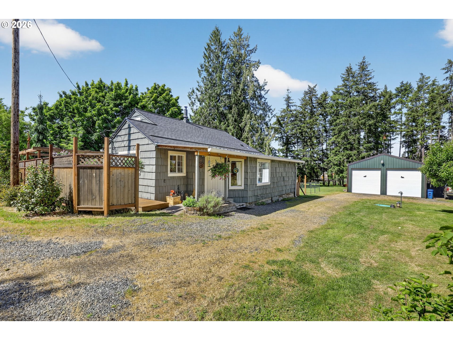 33951 Southeast Coupland Road Estacada, OR 97023 - Photo 1 of 48 a front view of a house with a garden