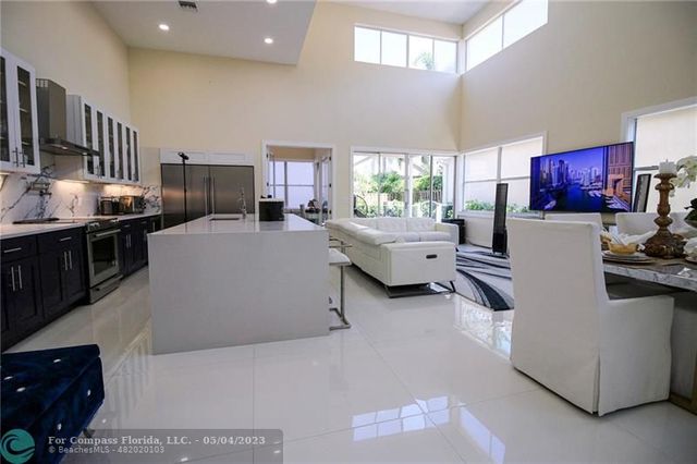 a living room with fireplace furniture and a window