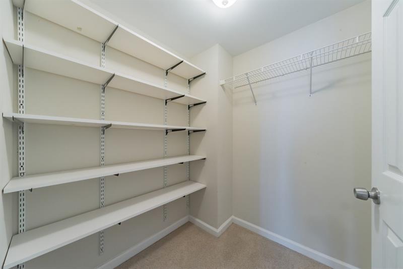 199 14th Street Northeast, Unit 705 Atlanta, GA 30309 - Photo 14 of 20 a view of walk in closet with empty racks