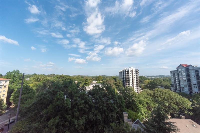 199 14th Street Northeast, Unit 705 Atlanta, GA 30309 - Photo 19 of 20 a view of a city with lush green forest