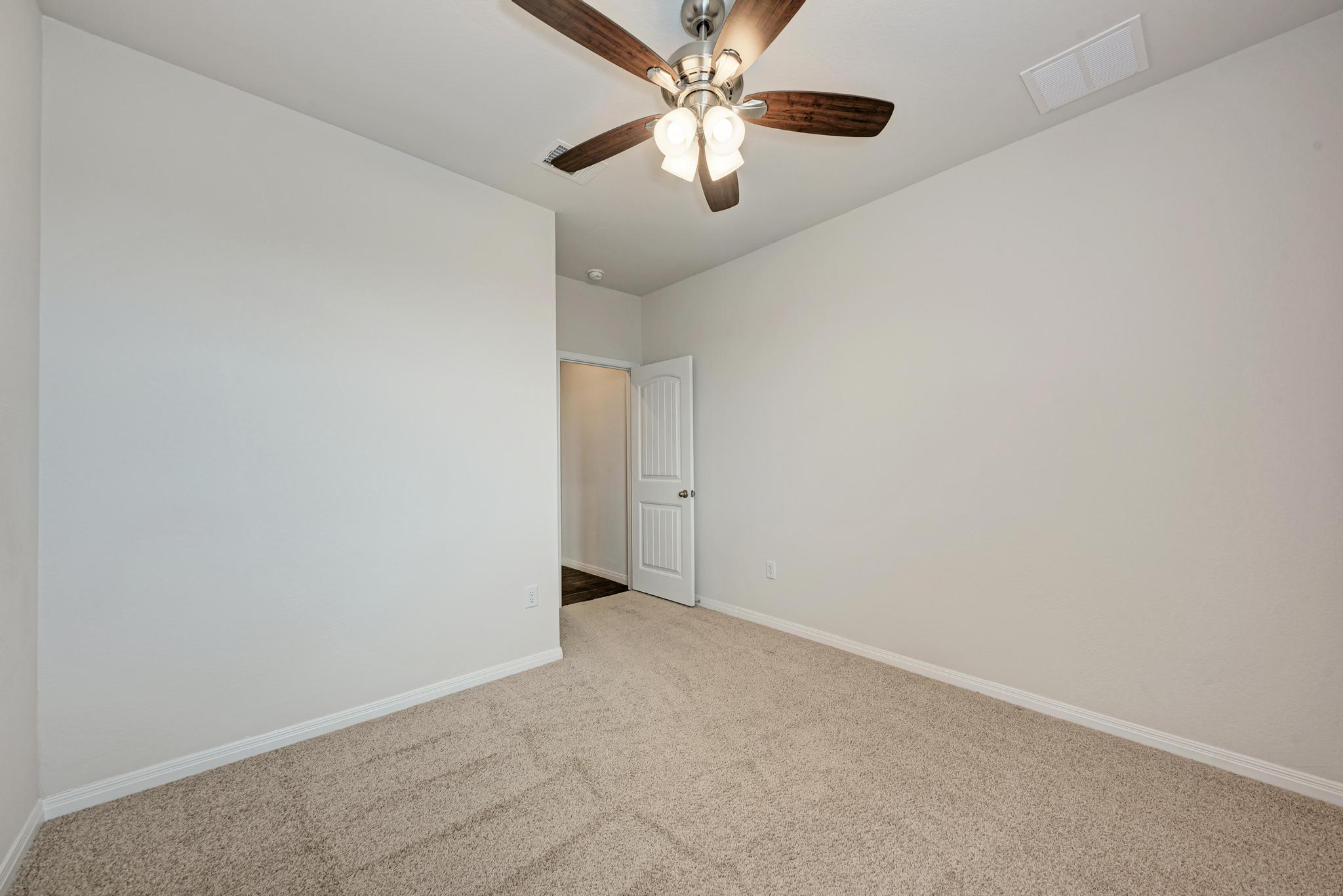 208 Abby Road Georgetown, TX 78626 - Photo 34 of 40 an empty room with chandelier fan