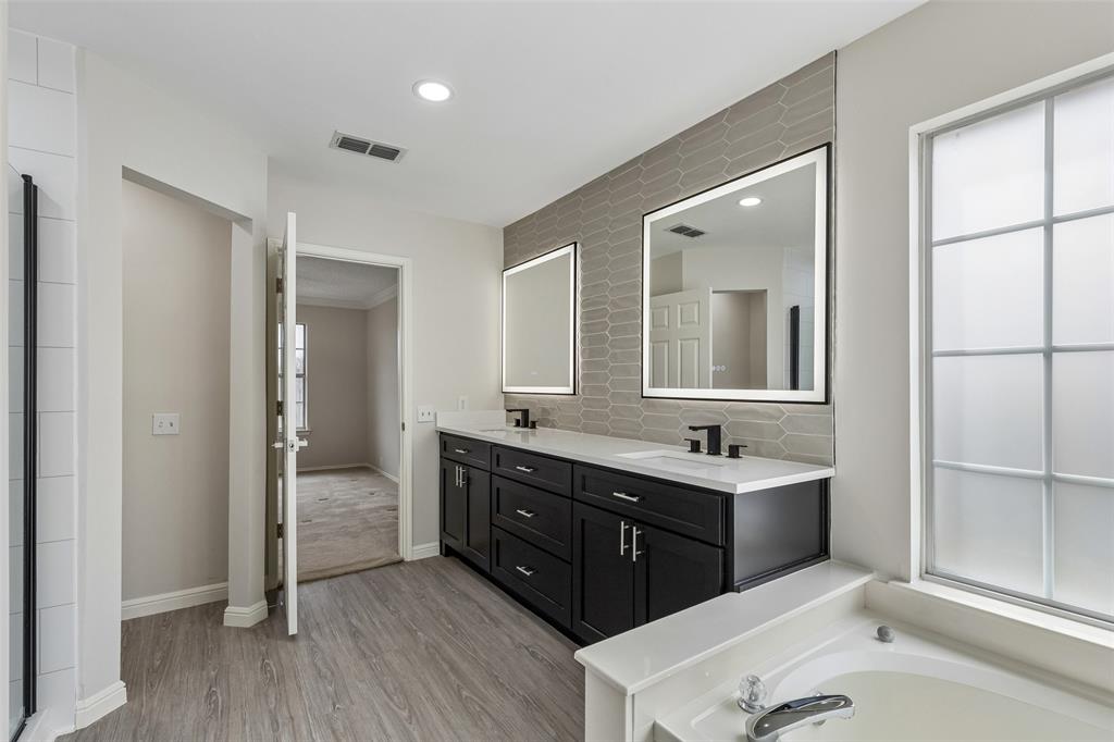 133 Hanover Street Grand Prairie, TX 75052 - Photo 21 of 31 a bathroom with a sink double vanity and a mirror