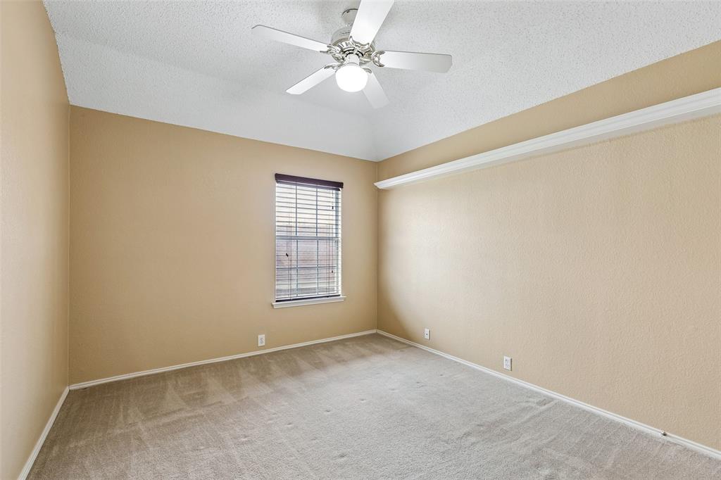 133 Hanover Street Grand Prairie, TX 75052 - Photo 24 of 31 an empty room with windows and fan