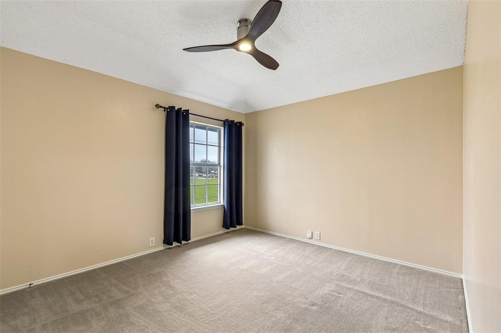 133 Hanover Street Grand Prairie, TX 75052 - Photo 26 of 31 a view of an empty room with a window