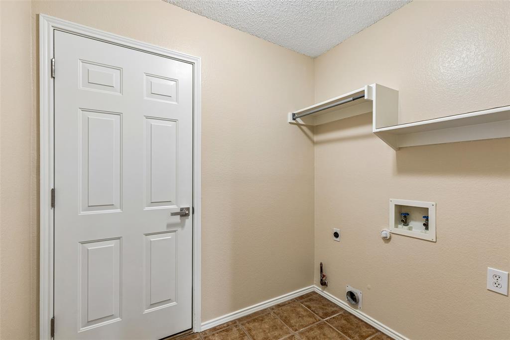 133 Hanover Street Grand Prairie, TX 75052 - Photo 29 of 31 a view of a storage & utility room with closet