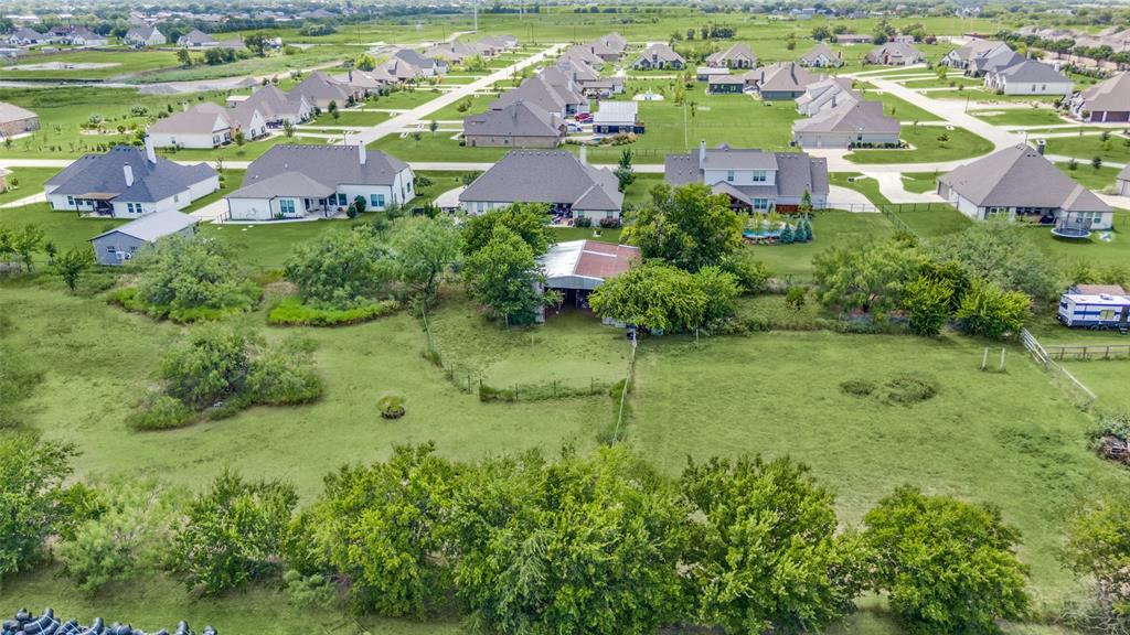 16777 John Wiley Road Justin, TX 76247 - Photo 13 of 16 an aerial view of residential houses with outdoor space and trees all around