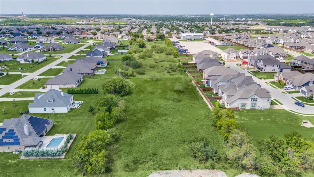 16777 John Wiley Road Justin, TX 76247 - Photo 14 of 16 an aerial view of residential houses with outdoor space and trees