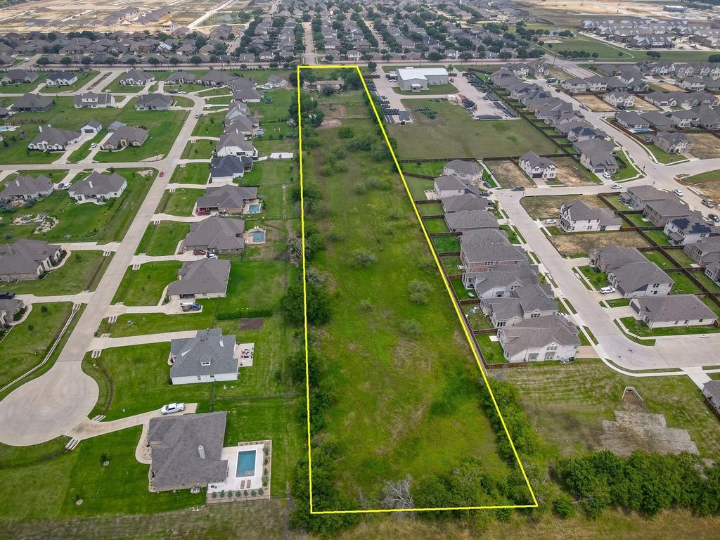 16777 John Wiley Road Justin, TX 76247 - Photo 16 of 16 an aerial view of residential houses with outdoor space