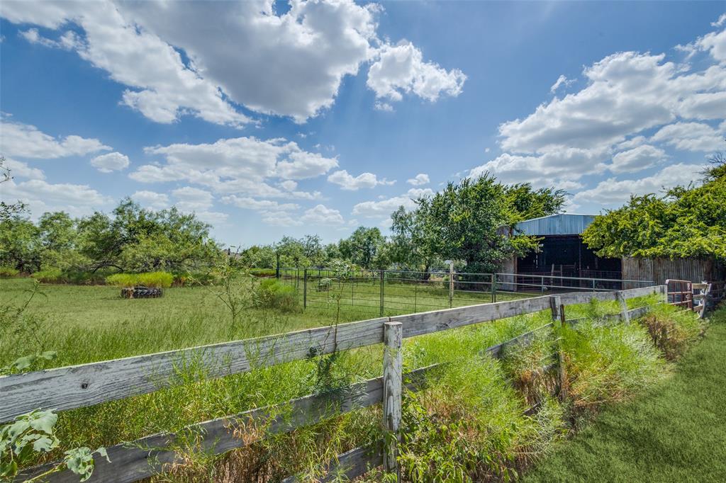 16777 John Wiley Road Justin, TX 76247 - Photo 9 of 16 a view of a backyard