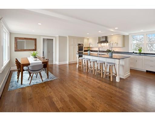 62 White Head Road Cohasset, MA 02025 - Photo 12 of 30 a living room with stainless steel appliances kitchen island granite countertop a dining table chairs and a refrigerator