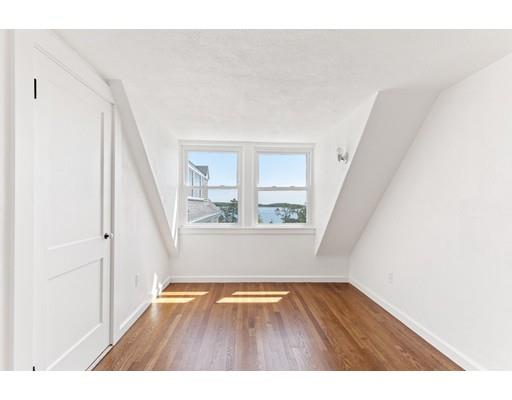 62 White Head Road Cohasset, MA 02025 - Photo 21 of 30 a view of an empty room with wooden floor and stairs