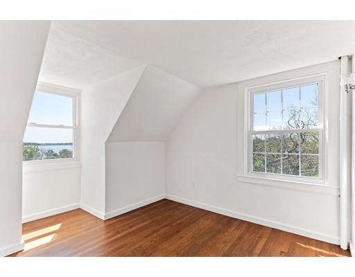 62 White Head Road Cohasset, MA 02025 - Photo 24 of 30 a view of an empty room with wooden floor and a window