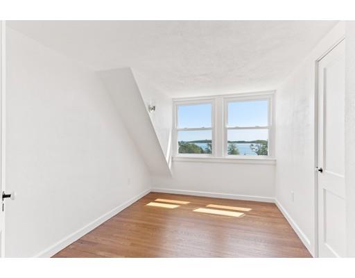 62 White Head Road Cohasset, MA 02025 - Photo 27 of 30 a view of empty room with wooden floor and fan