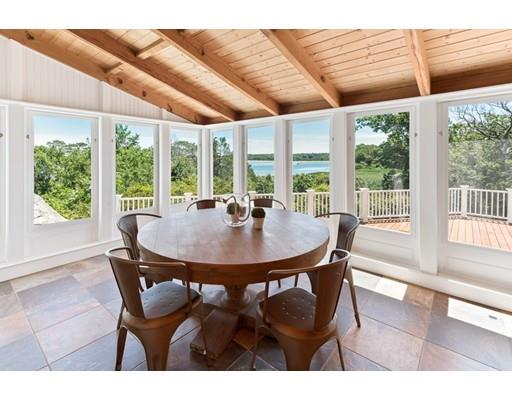 62 White Head Road Cohasset, MA 02025 - Photo 9 of 30 a view of a dining room with furniture window and outside view