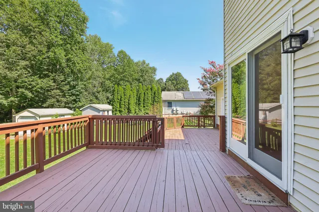 a view of a balcony with wooden floor