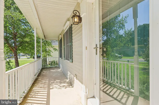 a view of a balcony with wooden floor