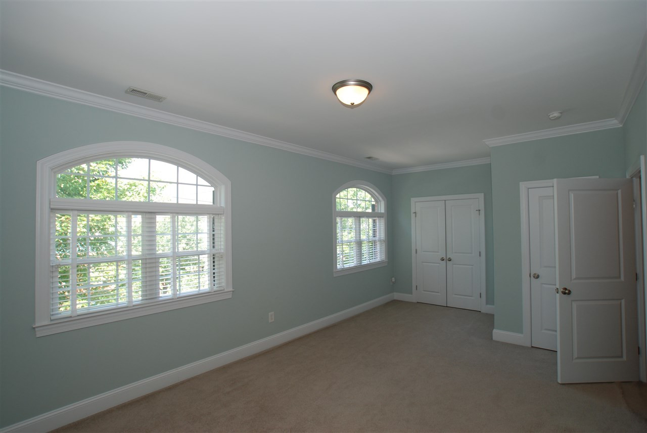 1228 North Blount Street Raleigh, NC 27604 - Photo 16 of 25 A large guest bedroom with double closets for storage. Guest bedroom
