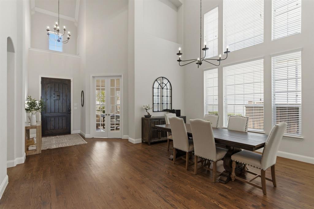 2801 Seabiscuit Road Celina, TX 75009 - Photo 3 of 39 Dining room with a chandelier, dark wood-style floors, and a high ceiling
