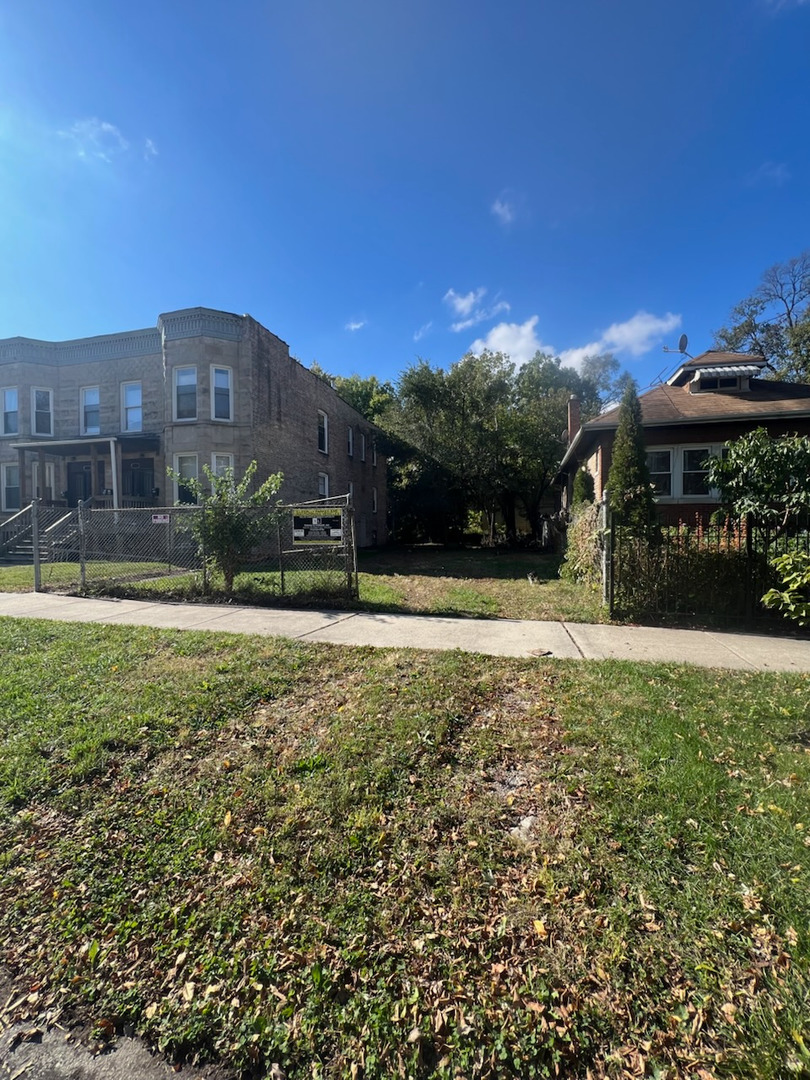 a view of swimming pool with a yard