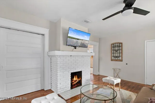 a living room with furniture and a fireplace