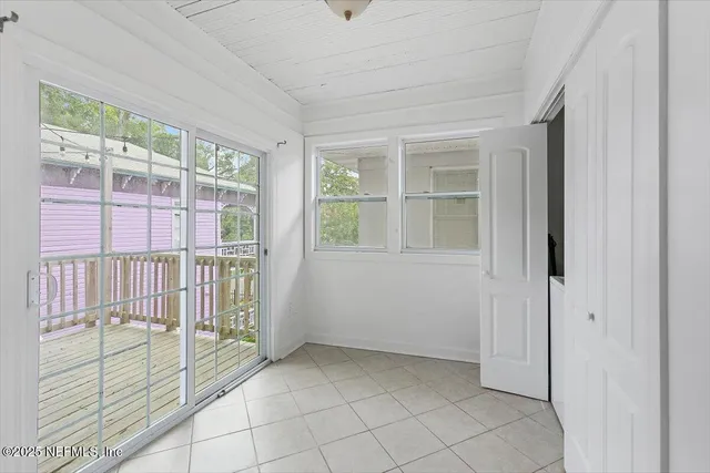a view of storage and utility room with closet