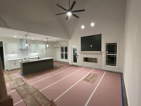 a hallway with a window and a kitchen