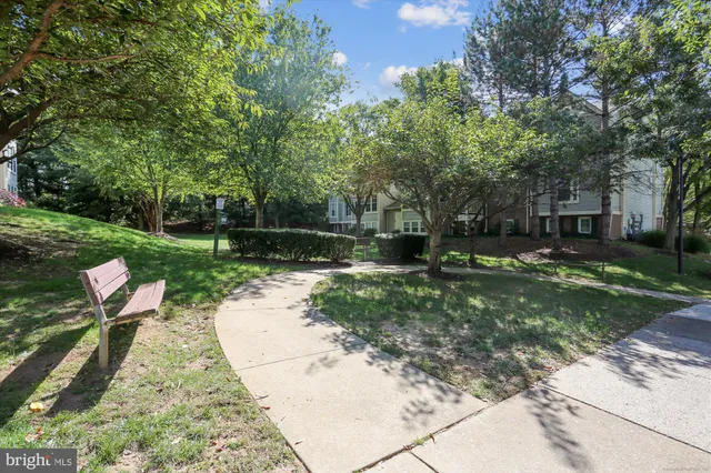 a small hurt is sitting in the middle of a yard