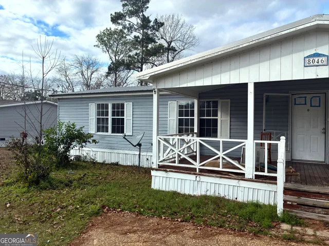 a house view with a garden space