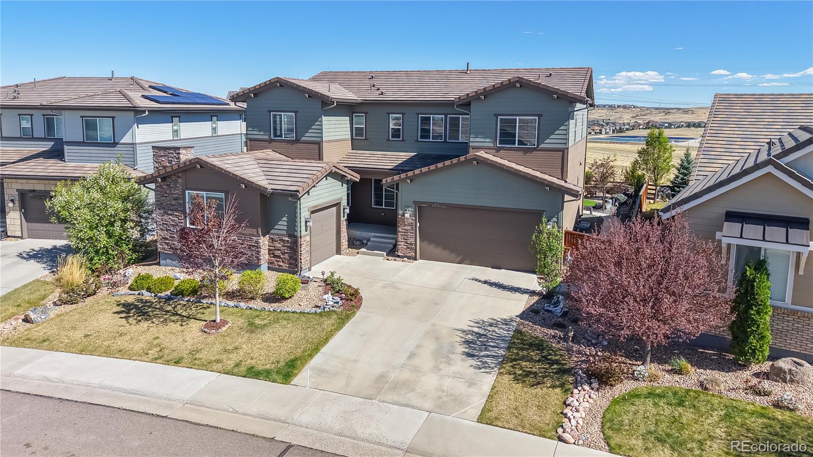 13950 Box Turtle Loop Parker, CO 80134 - Photo 26 of 48 a front view of a house with garden