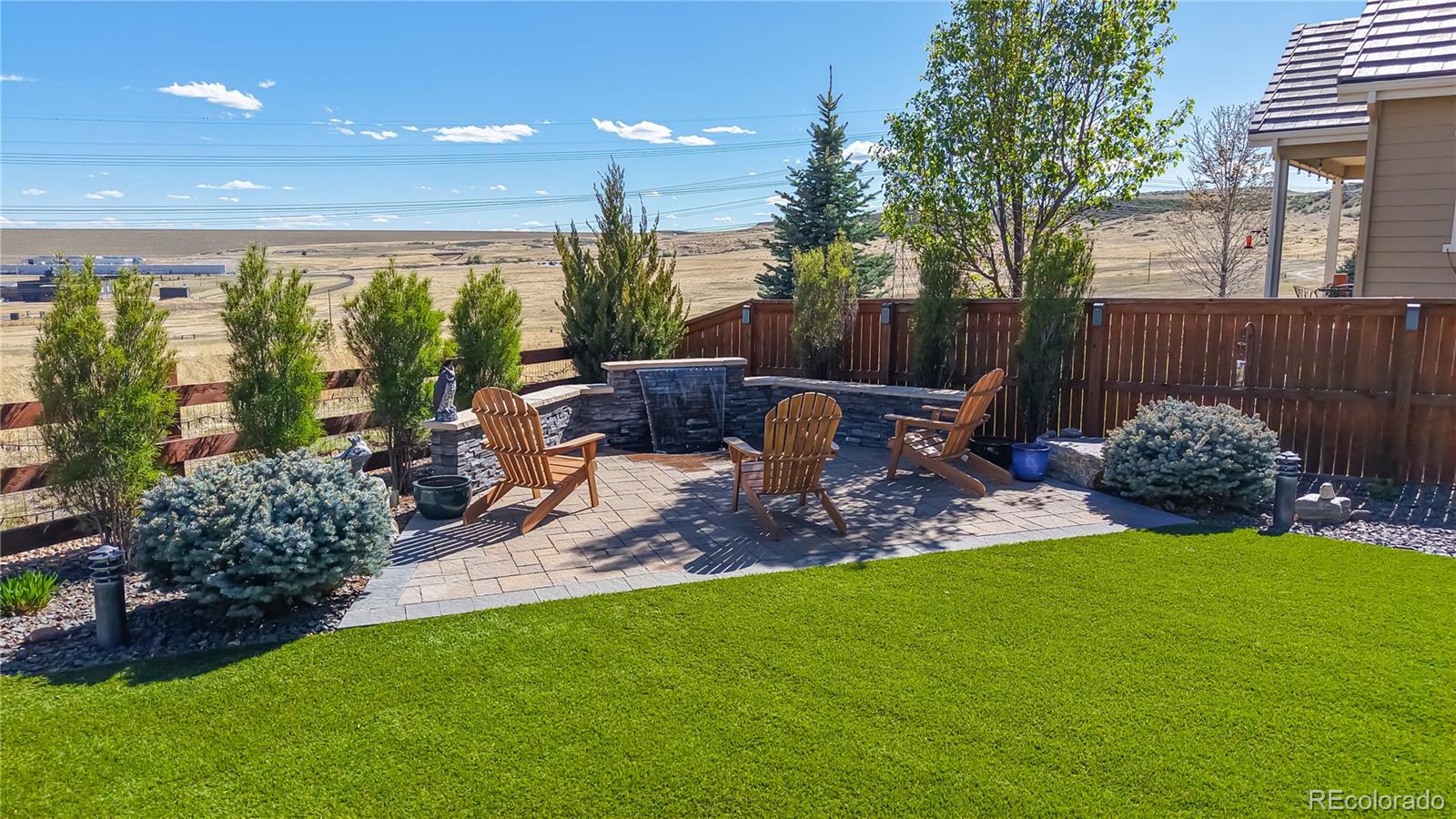 13950 Box Turtle Loop Parker, CO 80134 - Photo 3 of 48 a view of a porch with furniture and garden