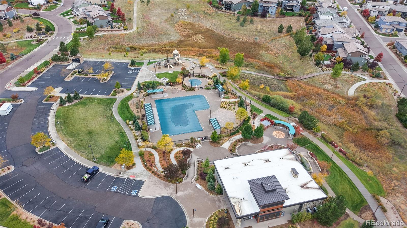 13950 Box Turtle Loop Parker, CO 80134 - Photo 37 of 48 an aerial view of a swimming pool with outdoor seating