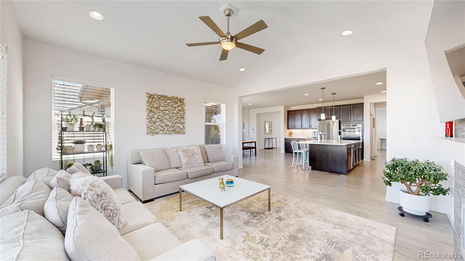 13950 Box Turtle Loop Parker, CO 80134 - Photo 7 of 48 a living room with furniture and a large window with garden view