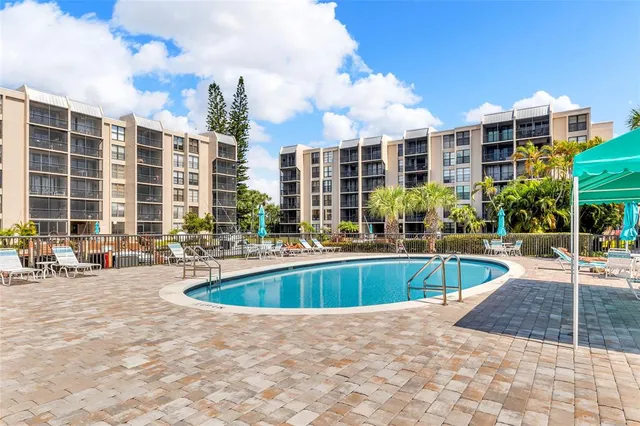 a view of a swimming pool with a lounge chairs