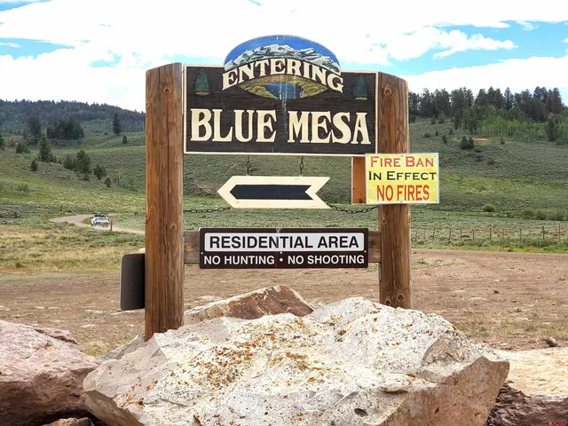 a sign on a pole on a road