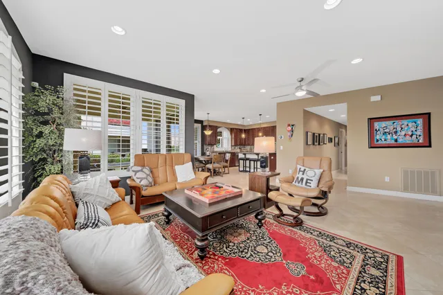 a kitchen with a sink a window and cabinets