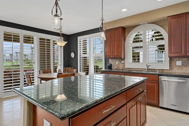 a view of a dining room that has a table and chairs