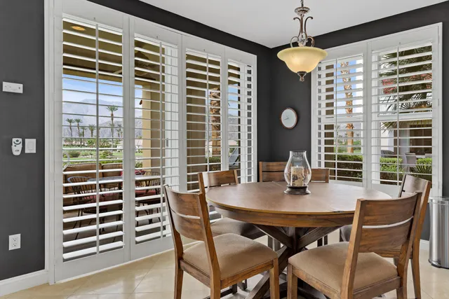 a spacious bathroom with a tub sink and mirror