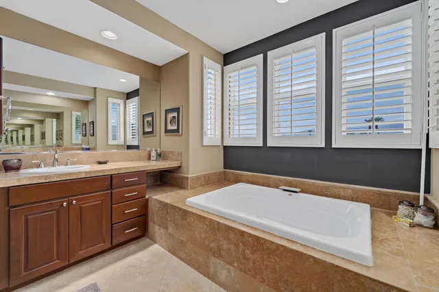 a bedroom with a bed and a television