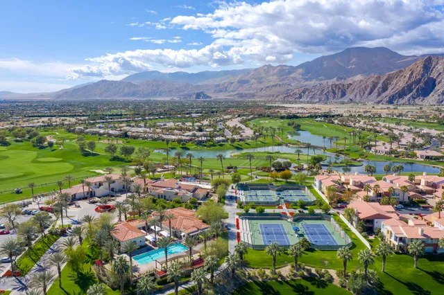an aerial view of a houses and city street
