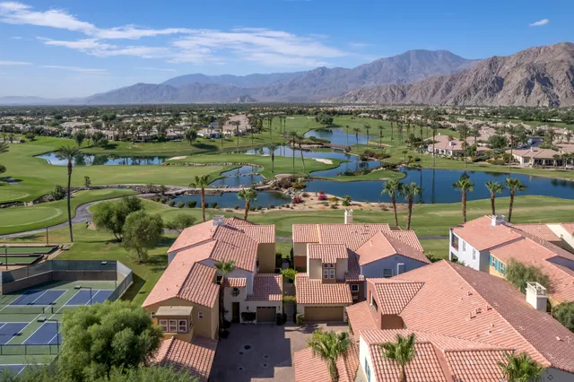 a view of a lake with a table and chairs