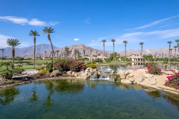 a outdoor living room with furniture and a window