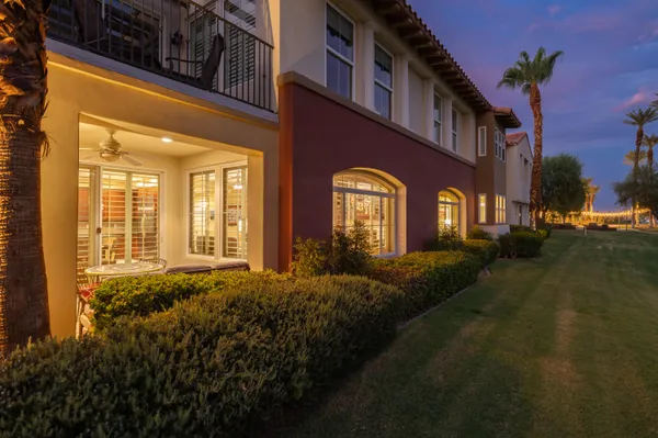 a view of a balcony with chair and table