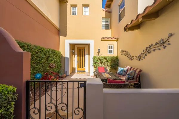 a living room with furniture and large windows