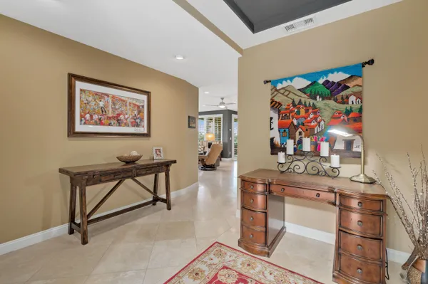 a living room with furniture a rug and a large window
