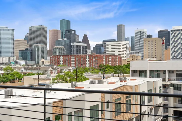 a view of walk in closet with clothes