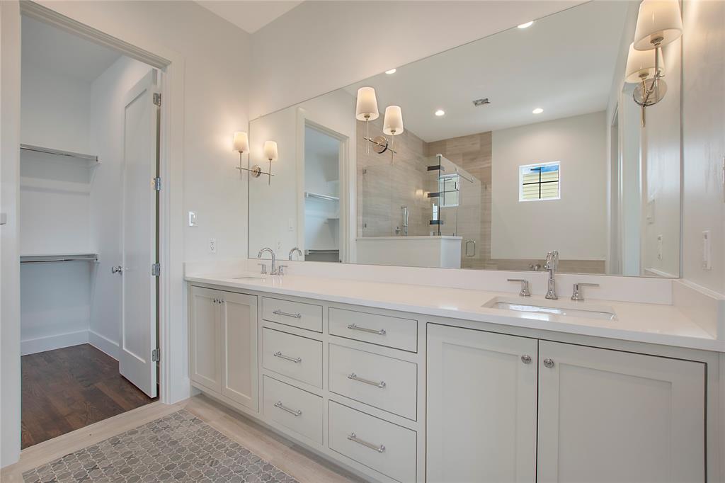 1031 Mobile Street Dallas, TX 75208 - Photo 15 of 28 a bathroom with a double vanity sink and a mirror