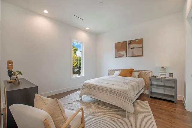 a bedroom with a bed and a couch