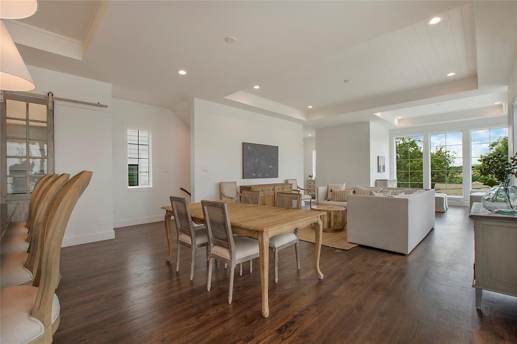 1031 Mobile Street Dallas, TX 75208 - Photo 7 of 28 a view of a dining room with furniture and wooden floor