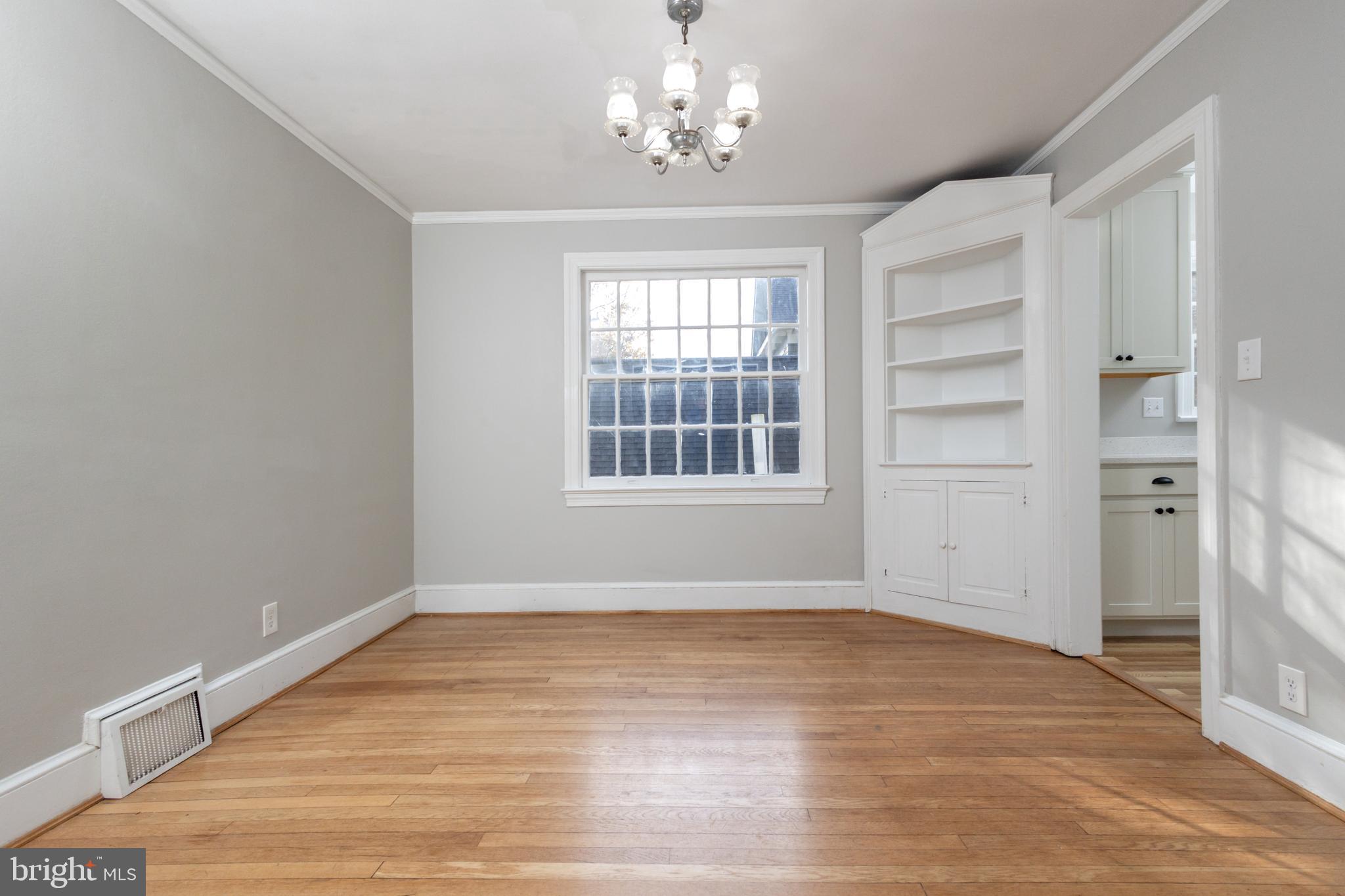 312 North Highland Street Arlington, VA 22201 - Photo 13 of 33 a view of empty room with wooden floor and fan